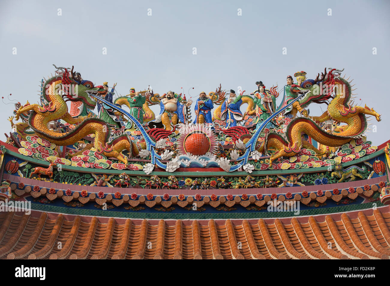 Taoist temple in Georgetown Penang. Laden with coulourful figures dominated by a pair of water dragons. Stock Photo