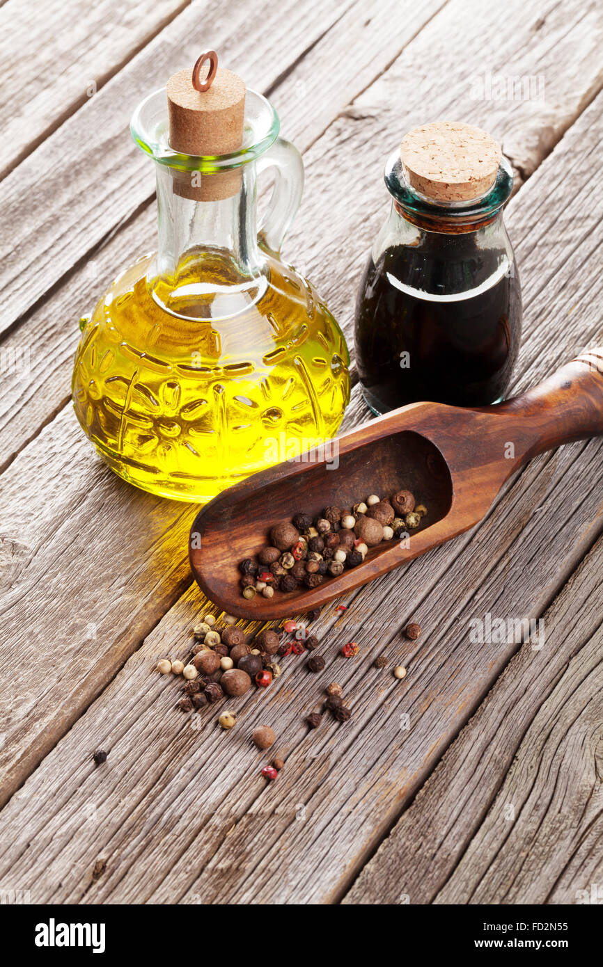 Spices and condiments on wooden table Stock Photo