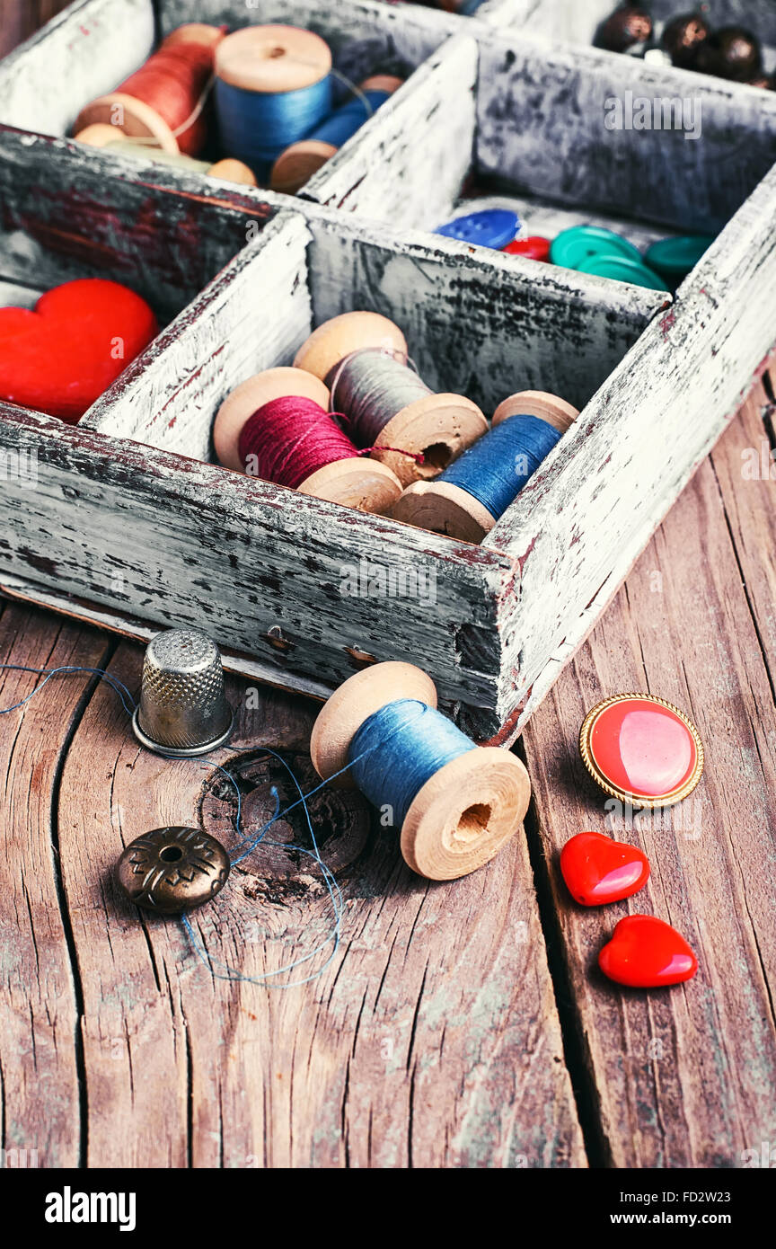 Wooden box with reels of sewing threads and buttons Stock Photo Alamy