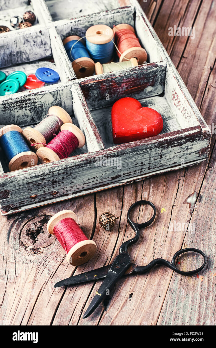 Wooden box with reels of sewing threads and buttons Stock Photo Alamy