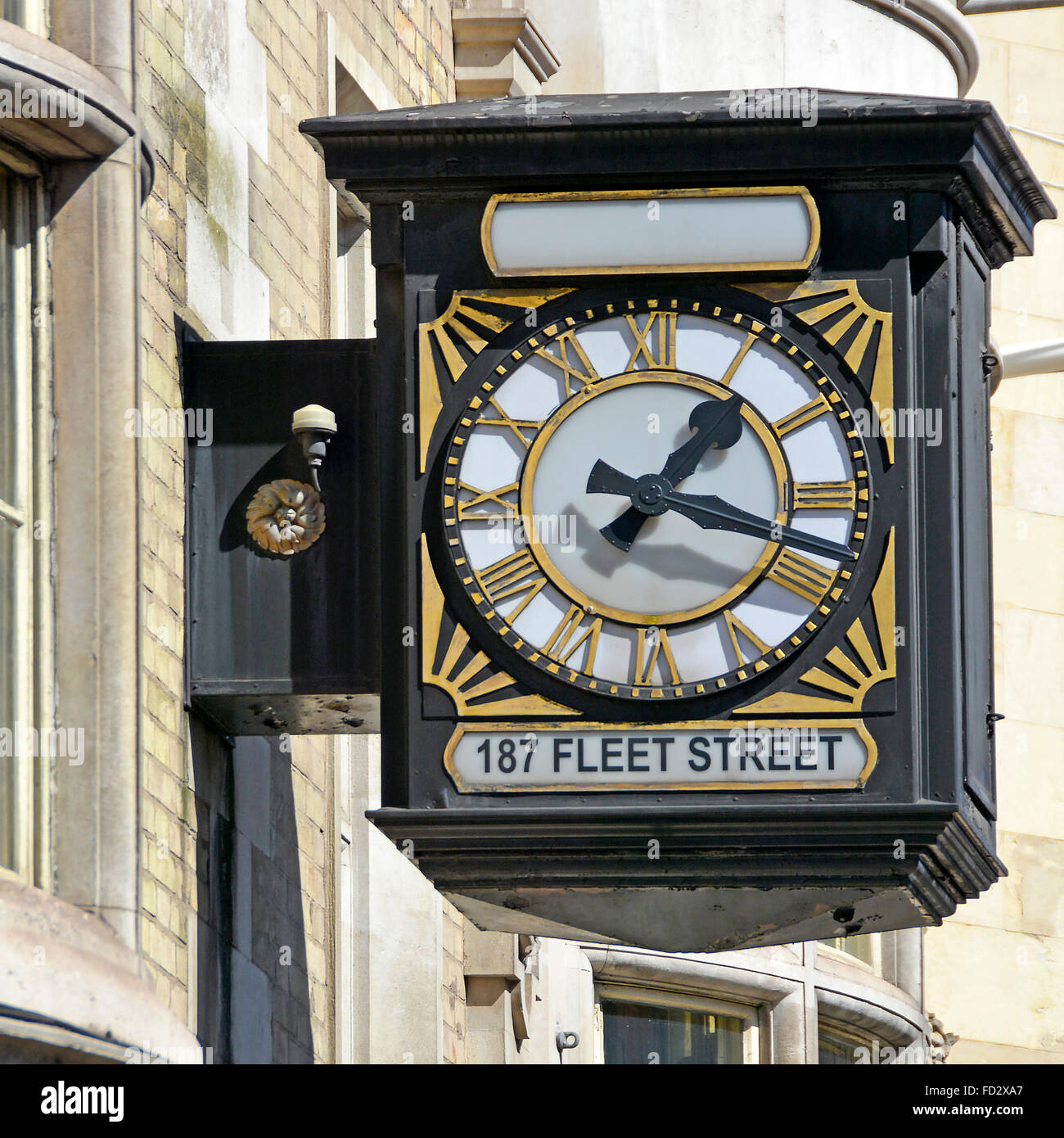Outdoor wall mounted clock on offices (occupied by barristers) with