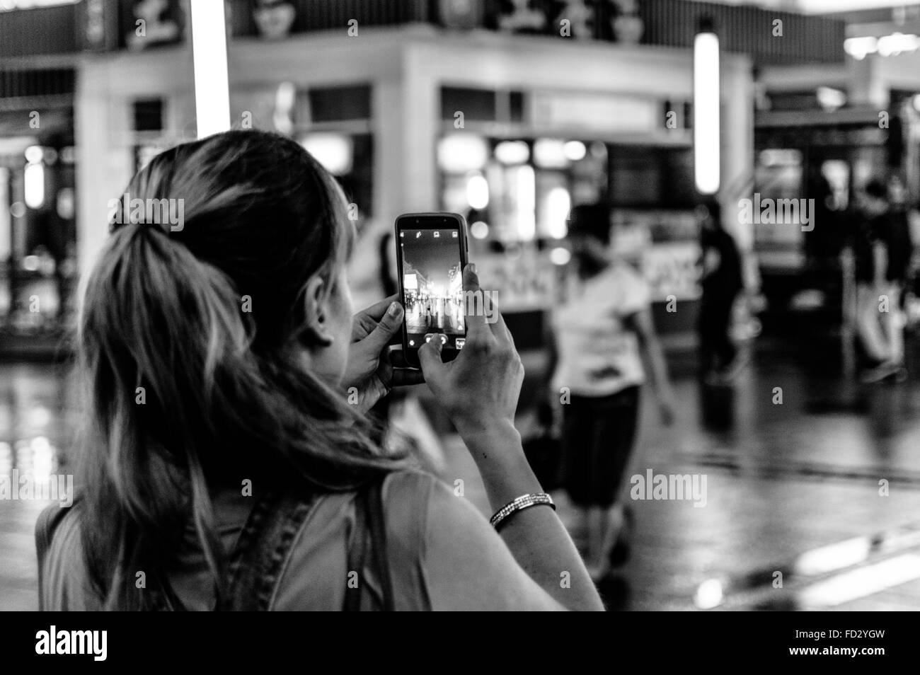 Rear view mature woman in Black and White Stock Photos & Images - Alamy