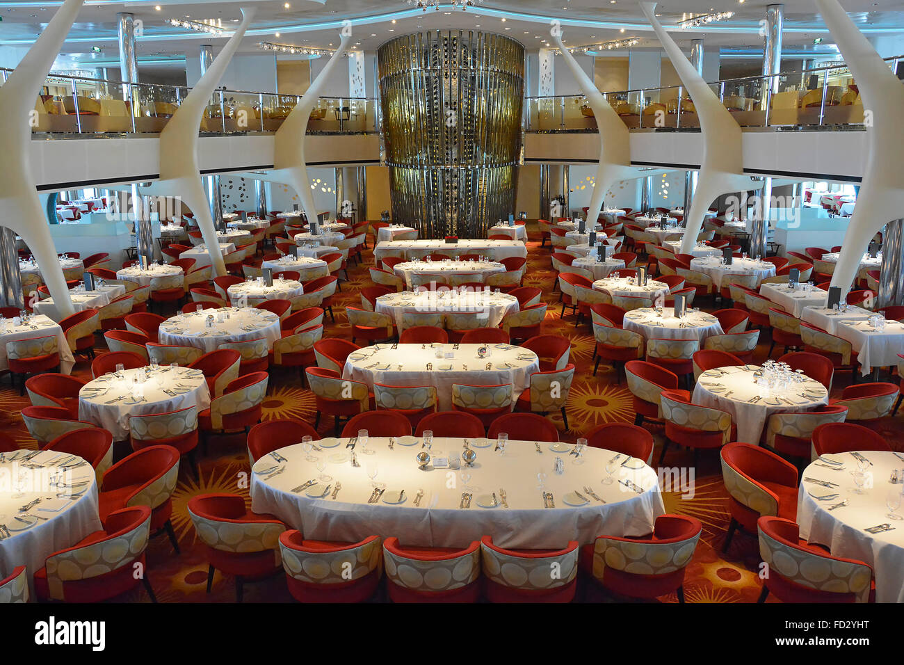 Cruise ship liner interior view of design of luxury restaurant place settings at tables & chairs prepared for evening of fine dining Mediterranean Sea Stock Photo