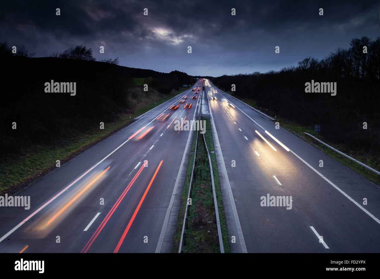 Light Trails of Fast Moving Cars on Busy British Motorway Stock Photo