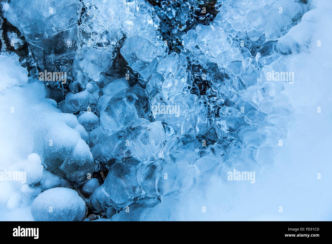 Frozen creek, frozen water, drops, ice in a stream, winter, Sauerland area, Germany Stock Photo