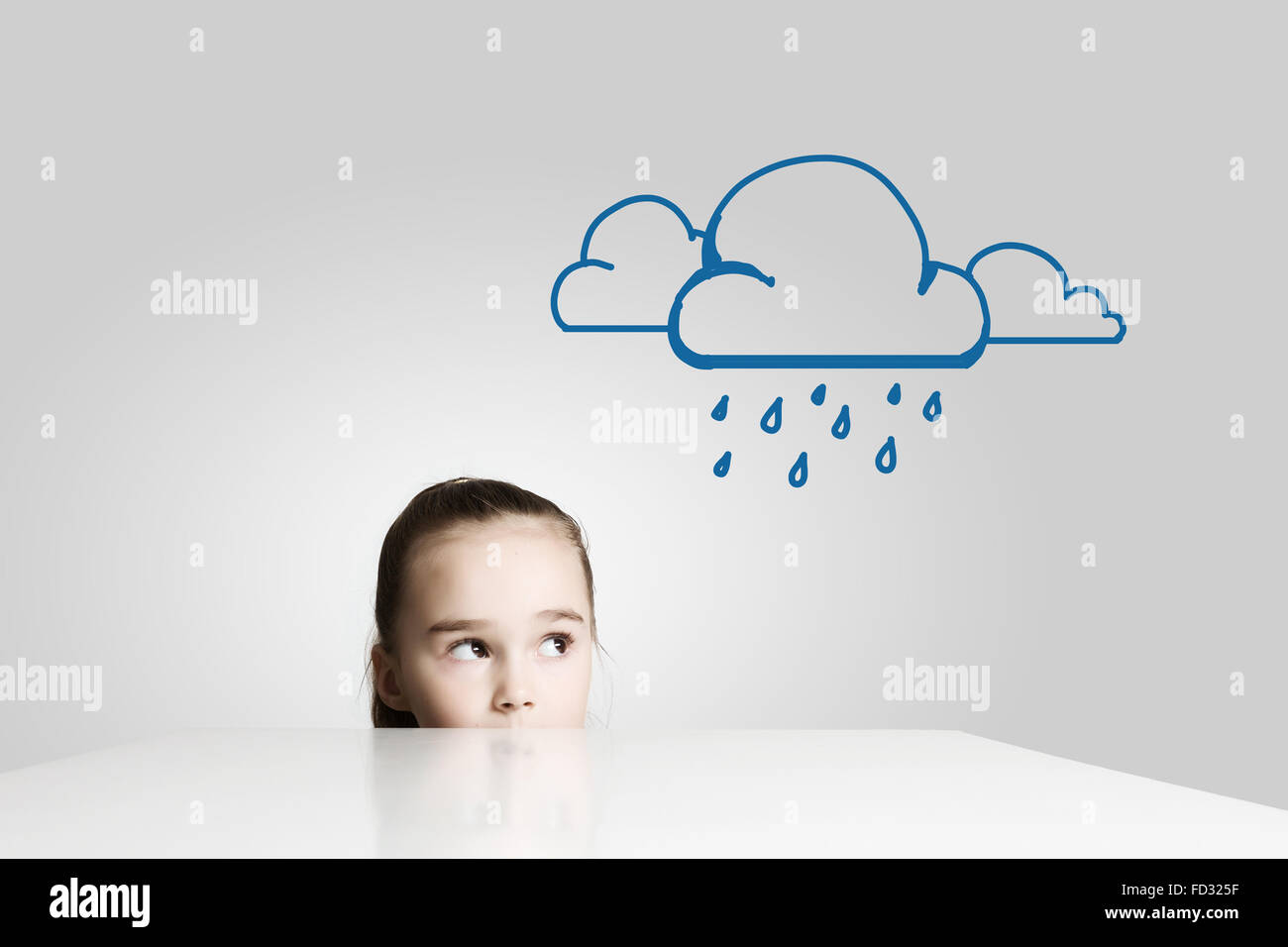 Little cute girl looking at raining cloud Stock Photo - Alamy