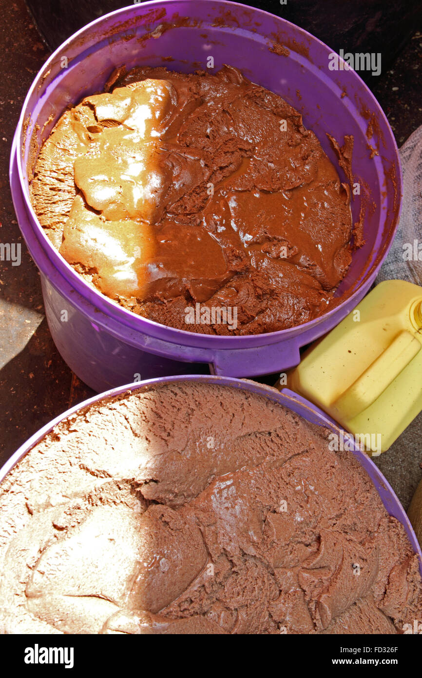 Two Large Plastic Containers Full Of Handmade Peanut Butter Stock Photo