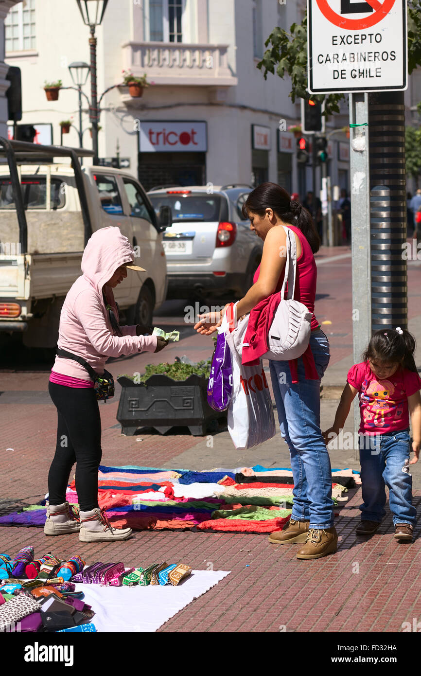 LA SERENA, CHILE - FEBRUARY 19, 2015: Unidentified street vendor and customer on Cordovez street in the city center Stock Photo
