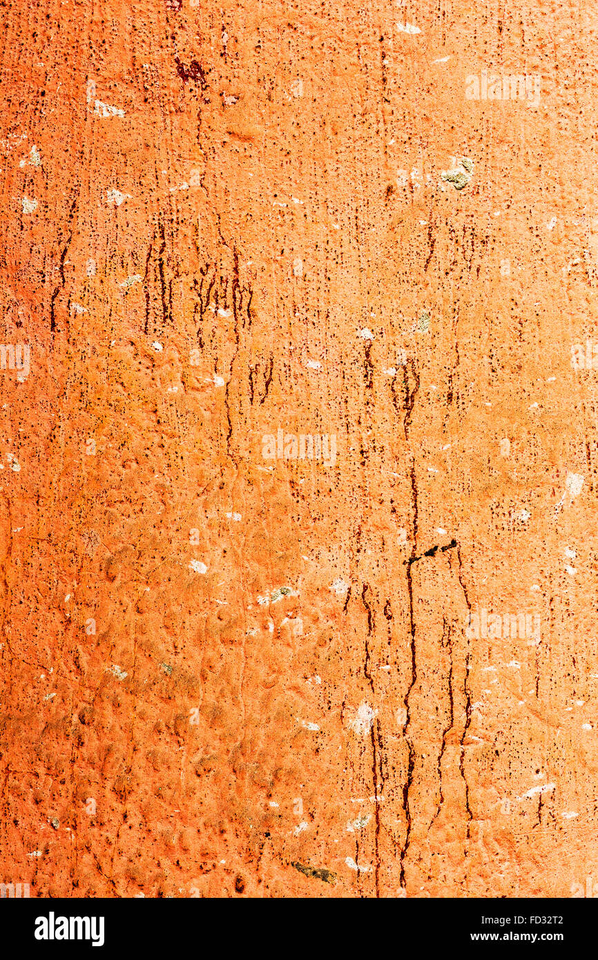 Creative background old concrete wall paint orange paint, stains water stains, cracks and scratches. Grungy concrete surface. Gr Stock Photo