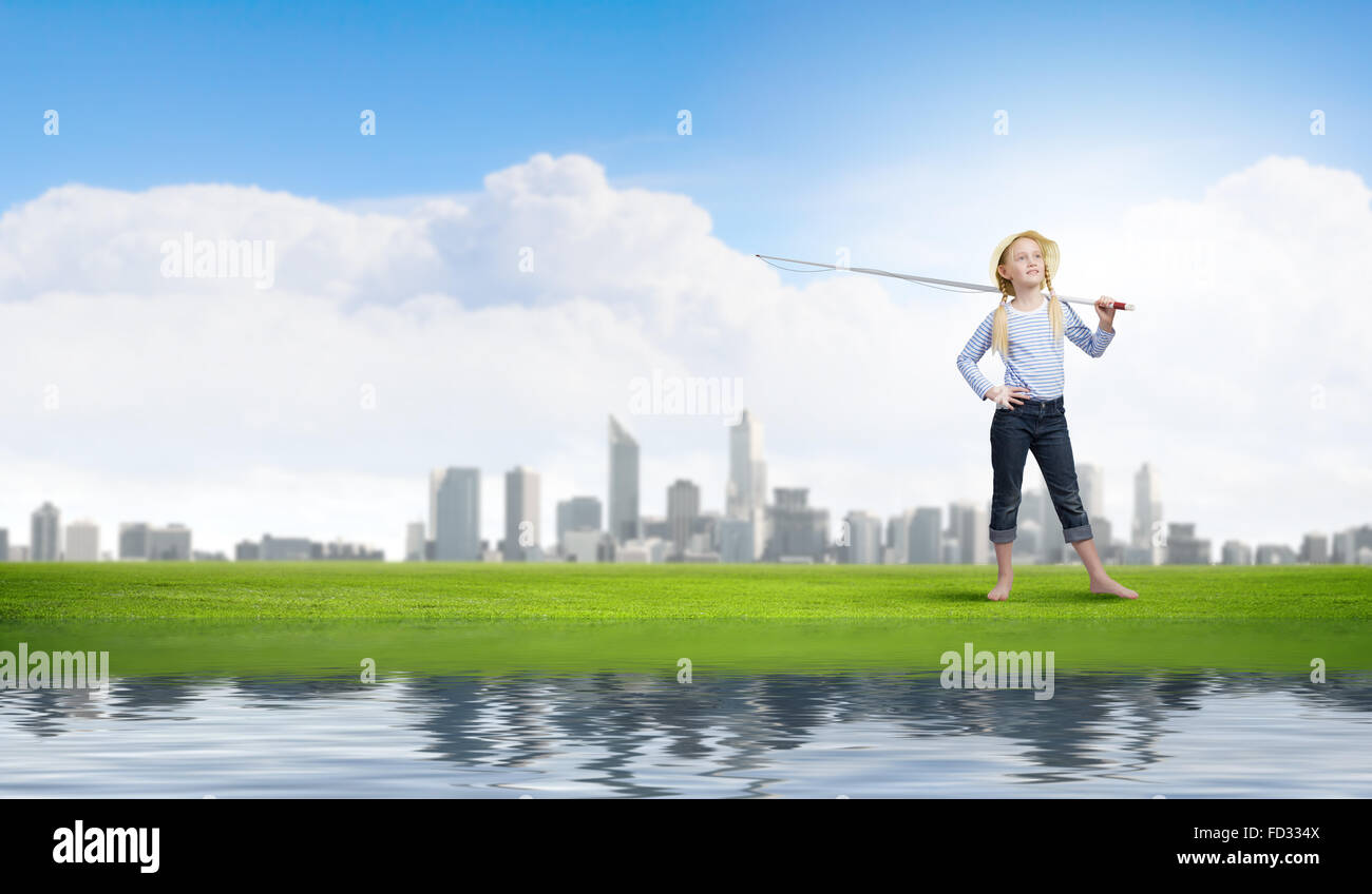 Cute girl with fishing rod on shoulder Stock Photo - Alamy