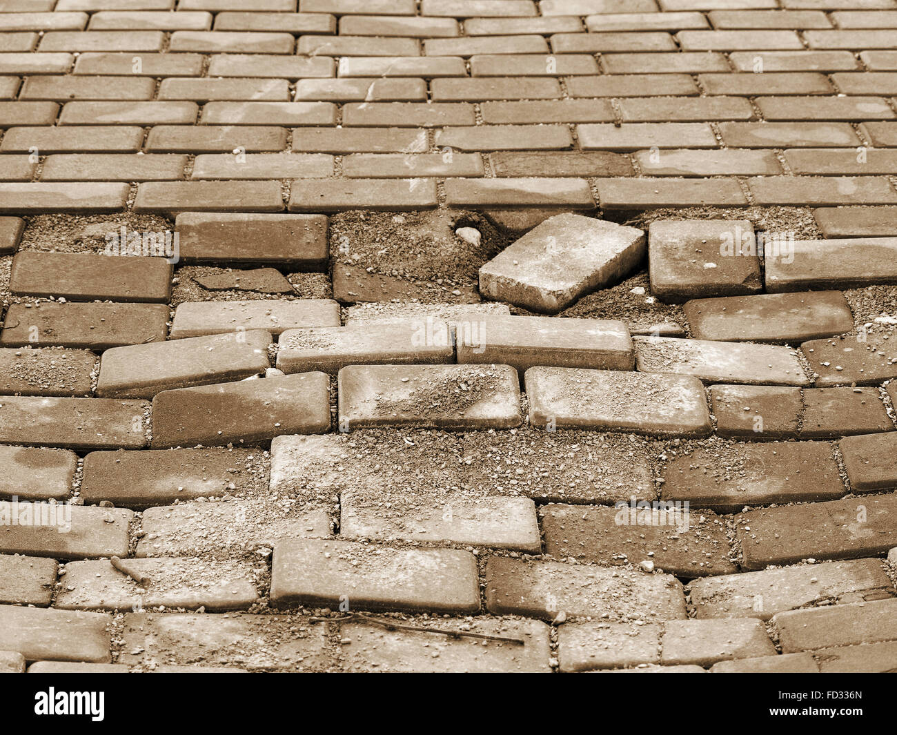 Destroyed paving slabs, requires urgent repairs. Selective focus Stock Photo