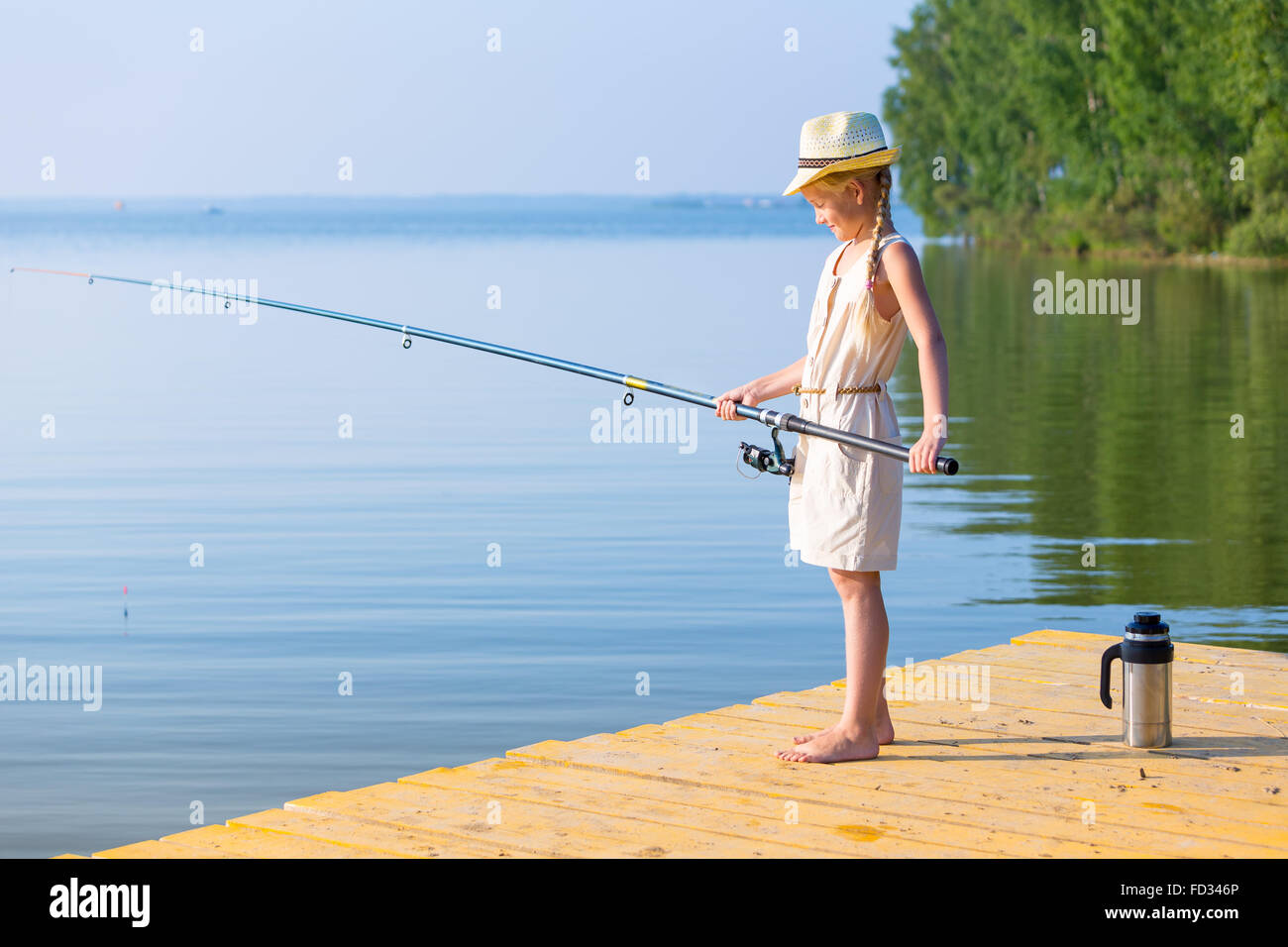 Child girl dock fishing hi-res stock photography and images - Page 2 - Alamy