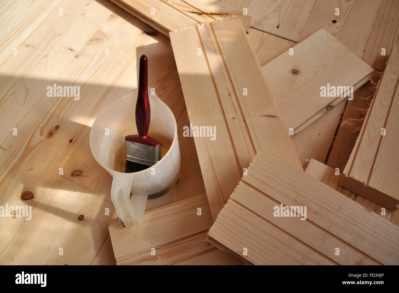 Section of a wooden floor being laid in a house. Stock Photo