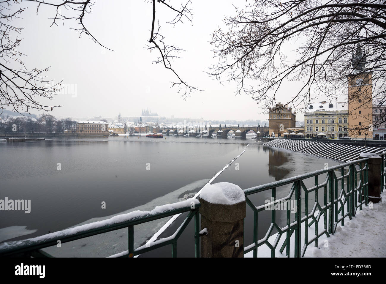 River Moldau with Prague Castle and St. Vitus Cathedral in background in winter time, Prague, Czech Republic Stock Photo