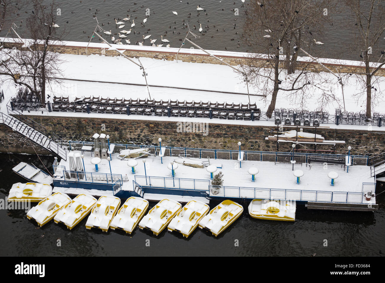 abandoned pedal boats on the Vltava in Winter, Prague, Czech republic Stock Photo