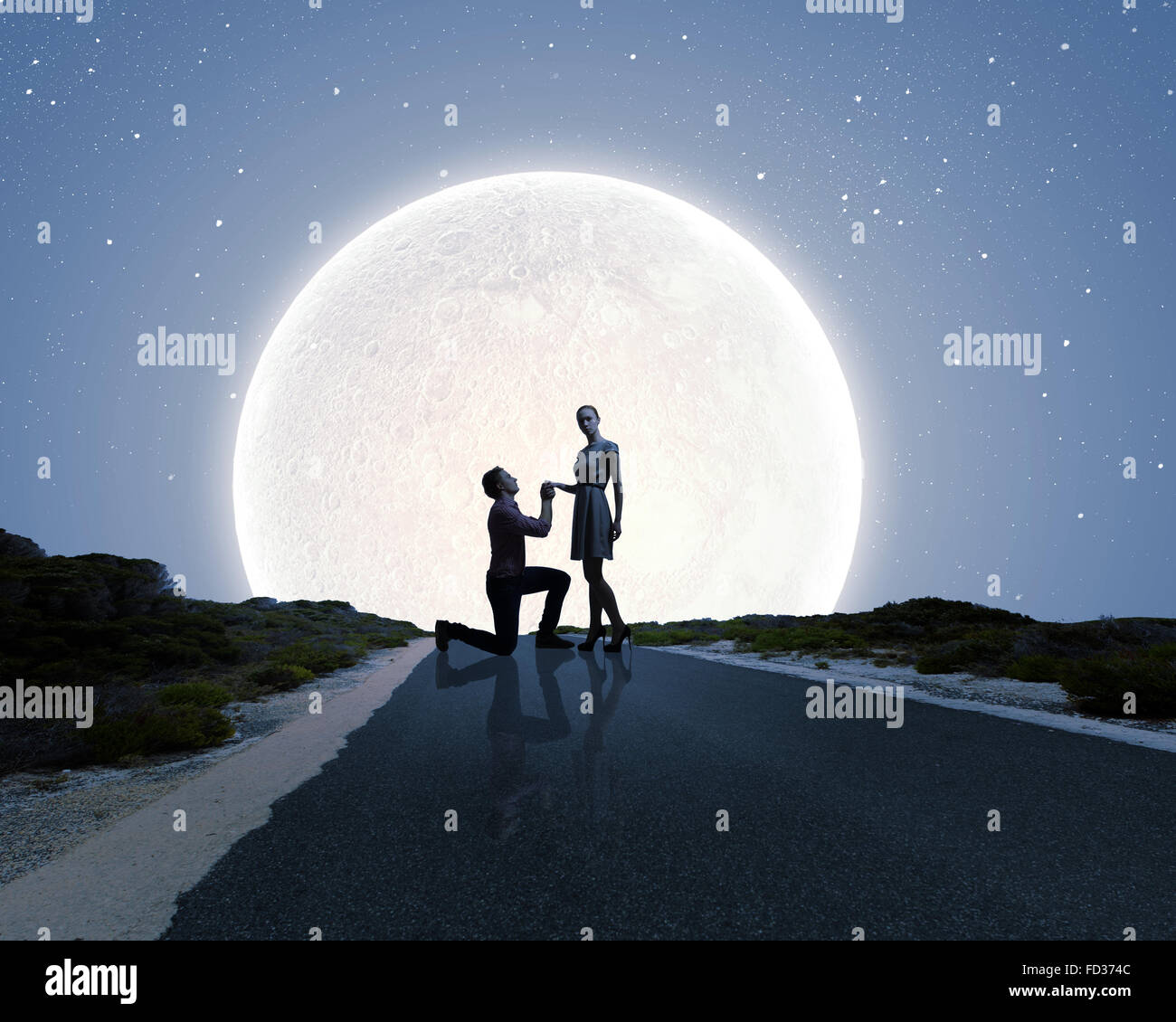Silhouettes of romantic couple under the moon light Stock Photo - Alamy