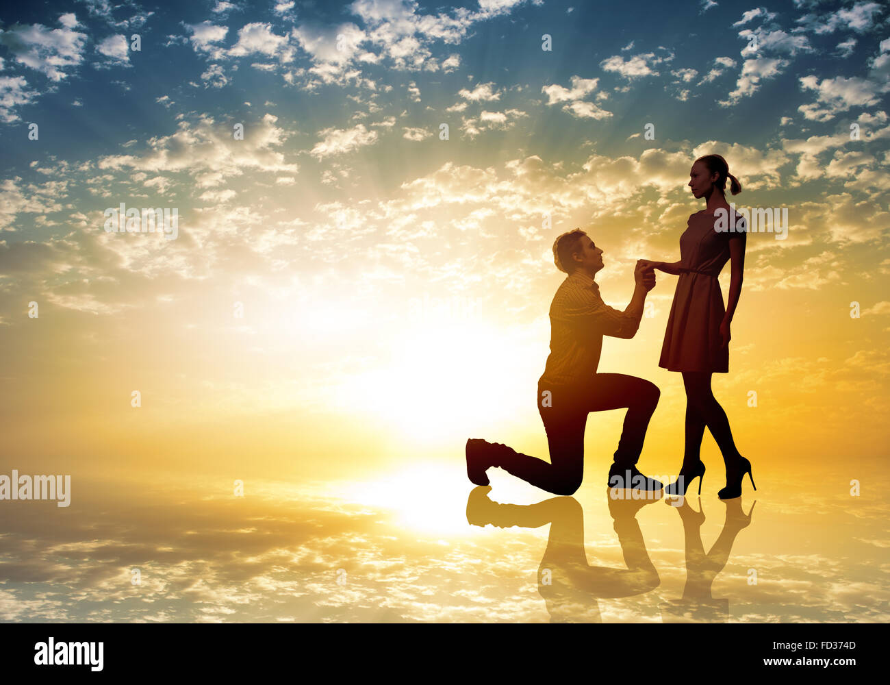 Proposing Position Young man standing on knees and proposing a woman Stock Photo - Alamy