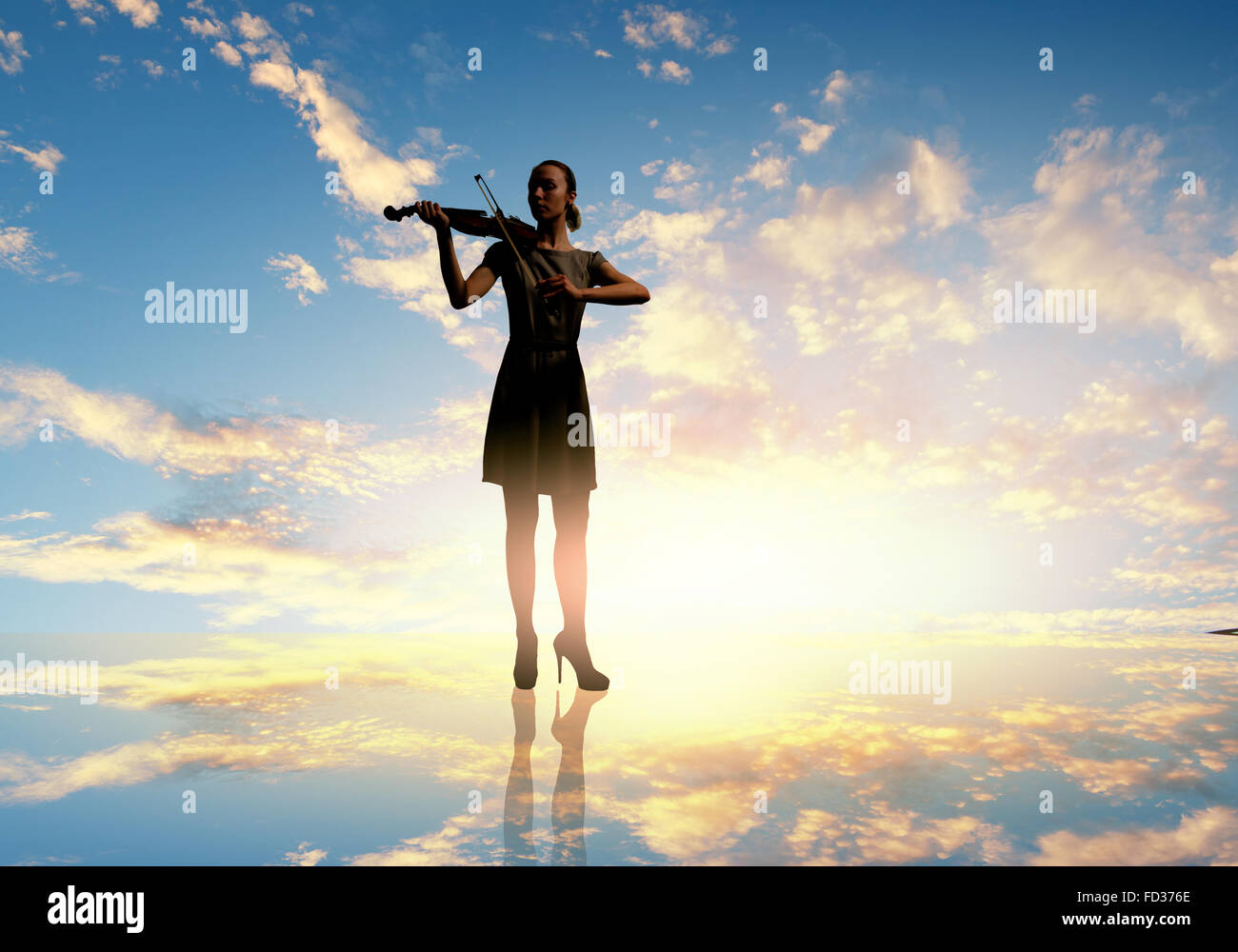 Silhouette of woman playing violin at sunrise Stock Photo - Alamy