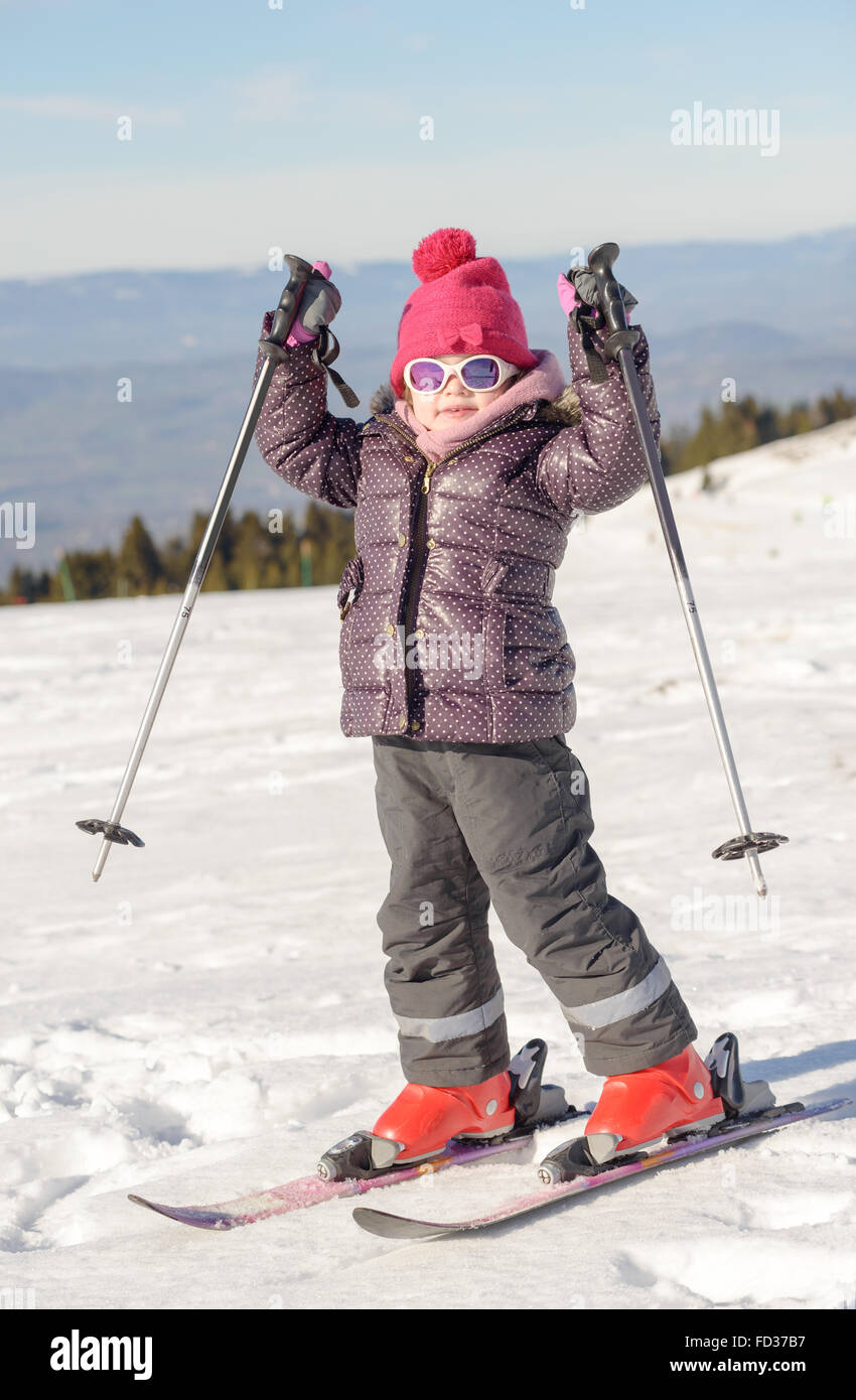 a happy little girl skiing downhill Stock Photo Alamy