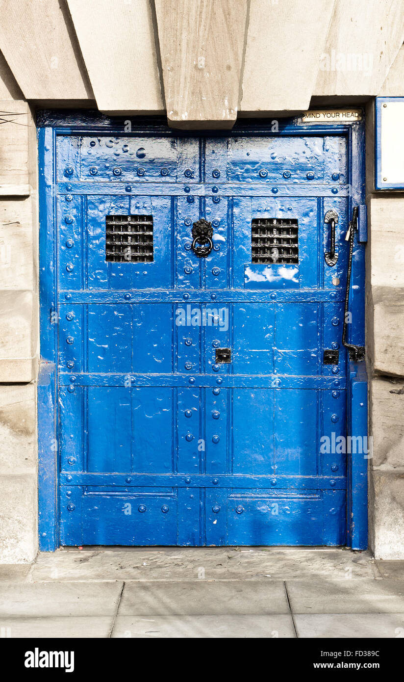 A medieval blue door with wrought iron bars Stock Photo Alamy