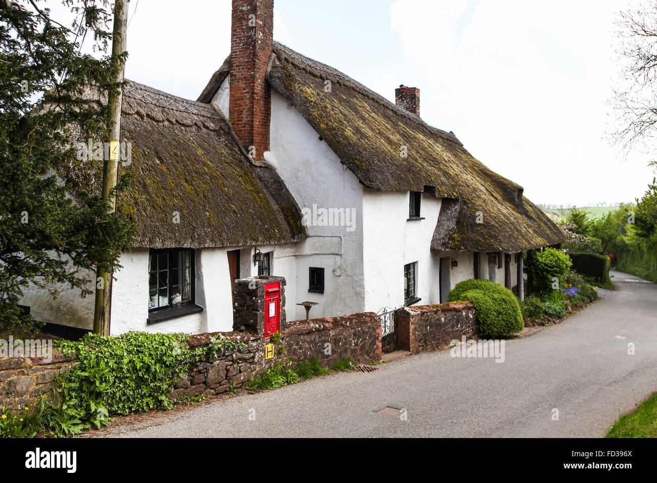 Dunchideock, Devon, UK, Traditional thatched cottage red mail letter ...