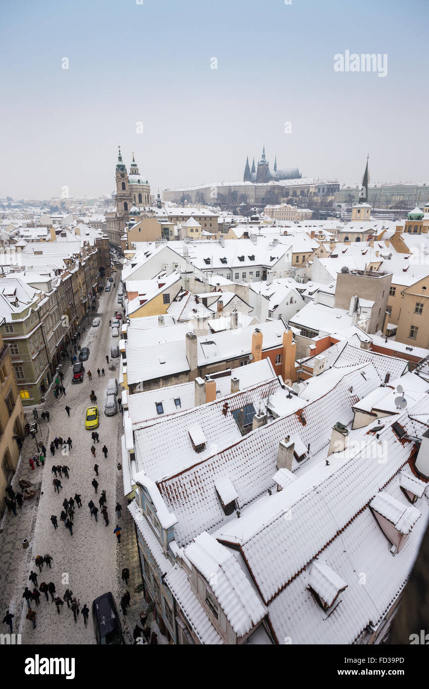 View of Saint Nicholas Cathedral on Bridge (Mostecka) Street in Lesser Town of Prague in winter, Czech Republic Stock Photo