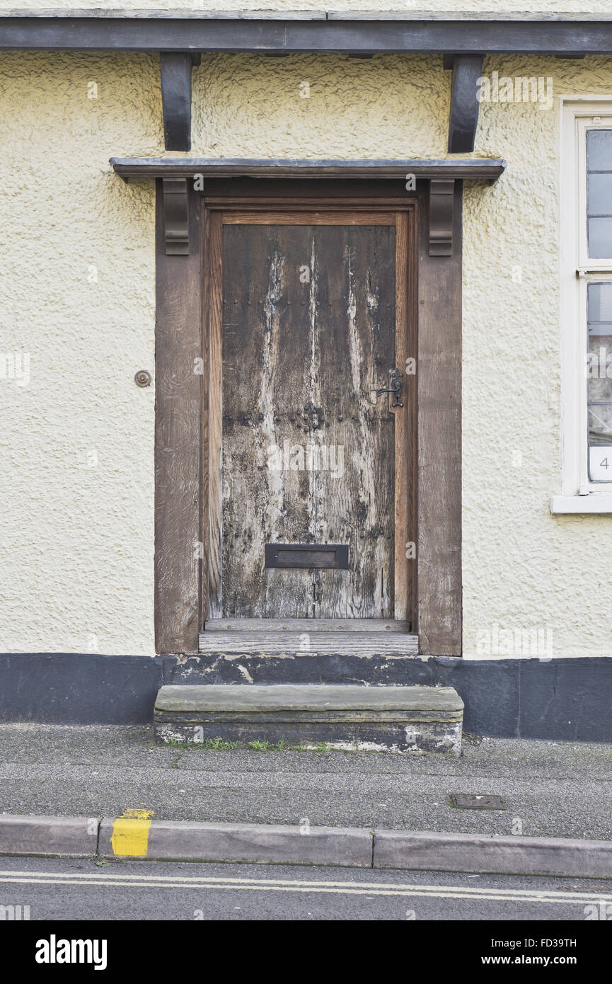 A wooden door on the front of a medieval english cottage Stock Photo