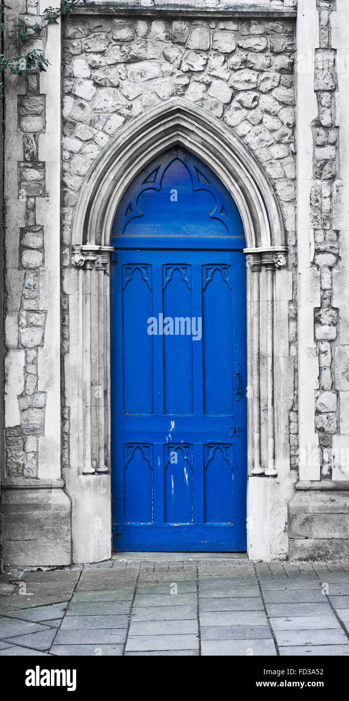 An Arch Shaped Blue Wooden Door In A Church In The Uk Stock Photo