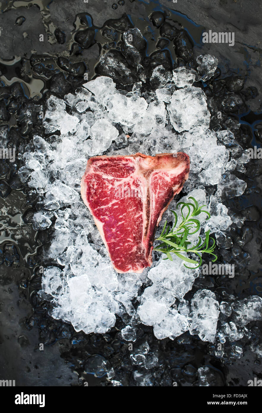 TBone steak on ice. Stock Photo