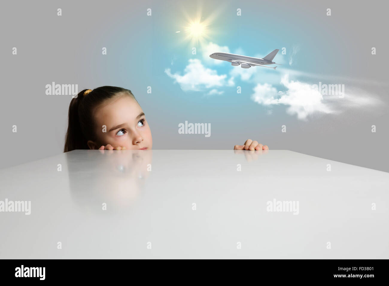 Little adorable girl looking at flying airplane Stock Photo - Alamy