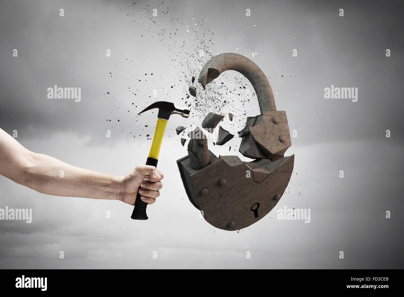 Close up of hammer in human hand breaking stone lock Stock Photo - Alamy