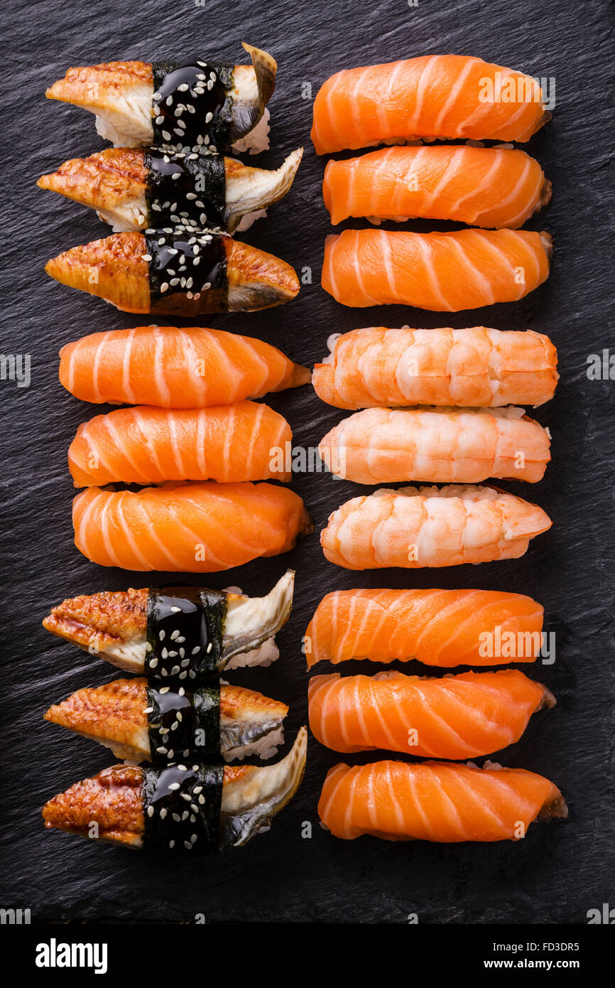 Sushi sashimi Set served on black stone slate Stock Photo