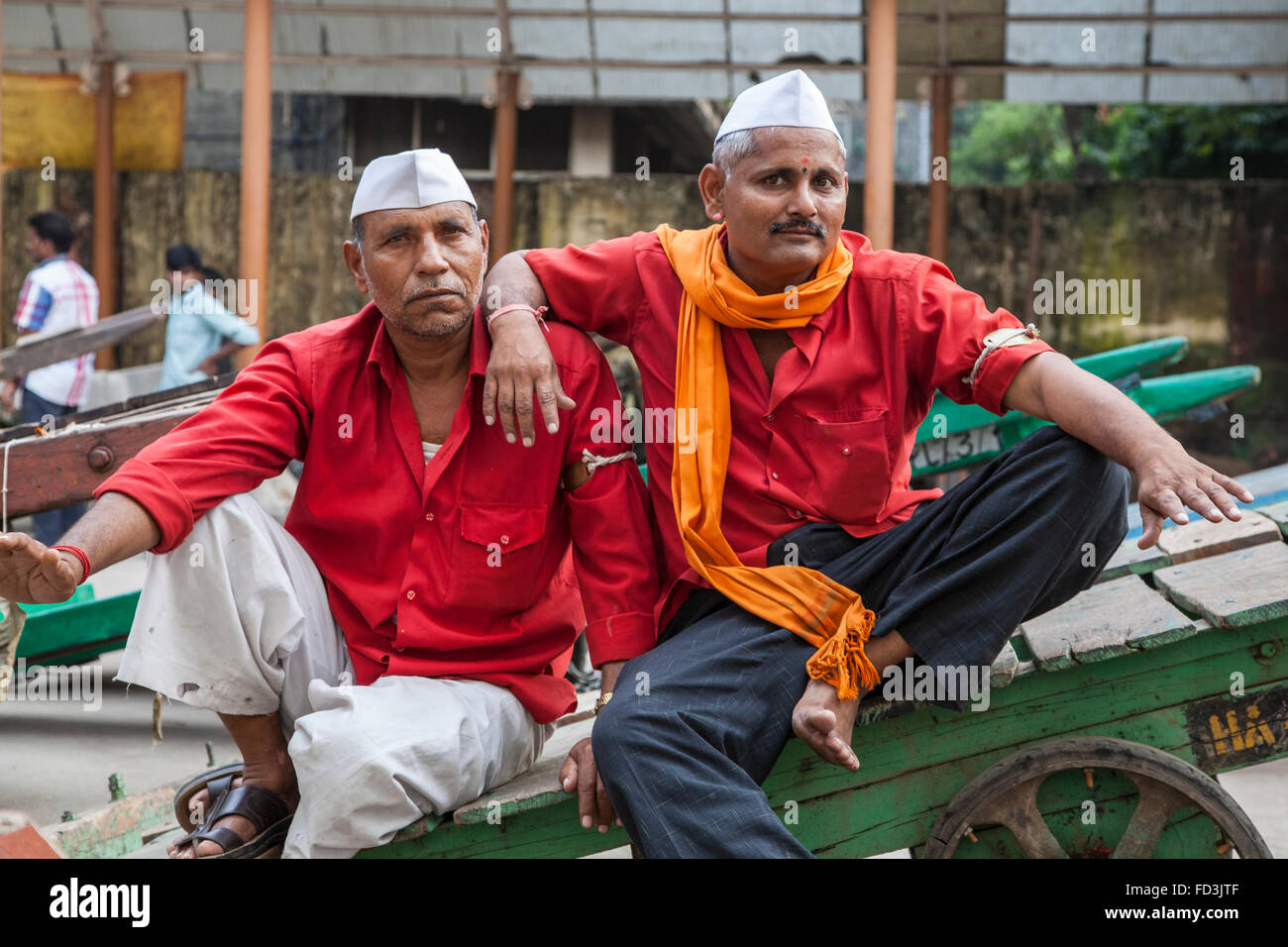 Railway porters (still known as Coolies) at Chhatrapati Shivaji Terminus (Victoria Terminus) in Mumbai (Bombay). Stock Photo