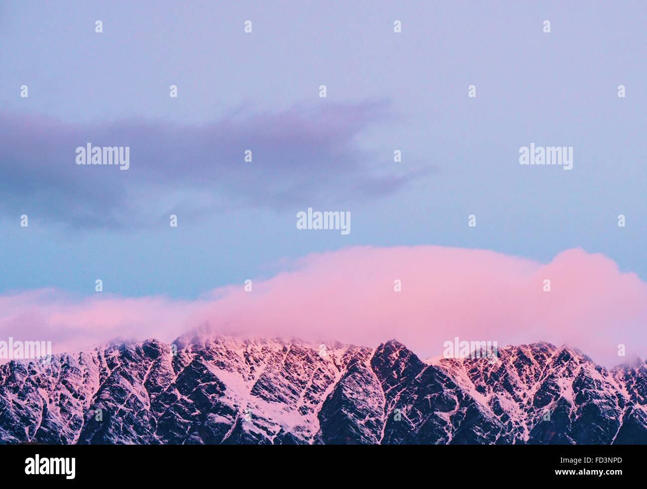 The Remarkables lit up by a pink sunset in beautiful Queenstown, New ...