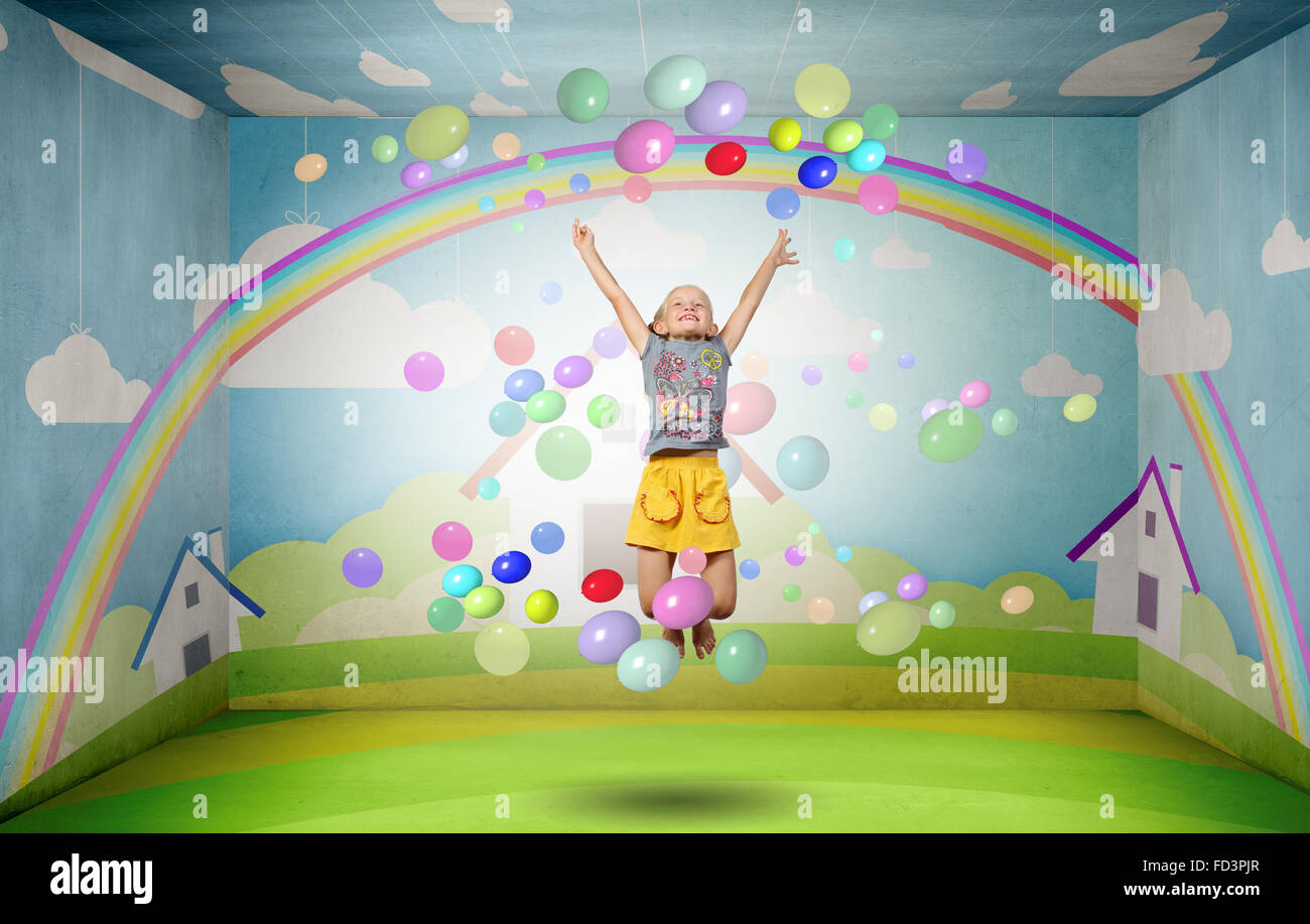 Little cute girl jumping high and flying in sky Stock Photo - Alamy