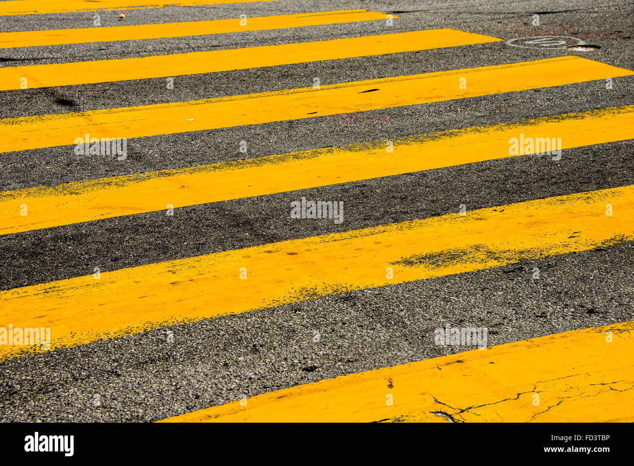 Yellow striped pedestrian street crosswalk Stock Photo