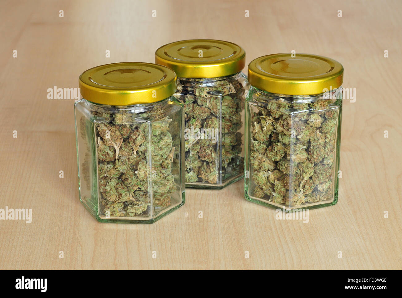 Photo of dry cannabis buds stored in a glass jars Stock Photo