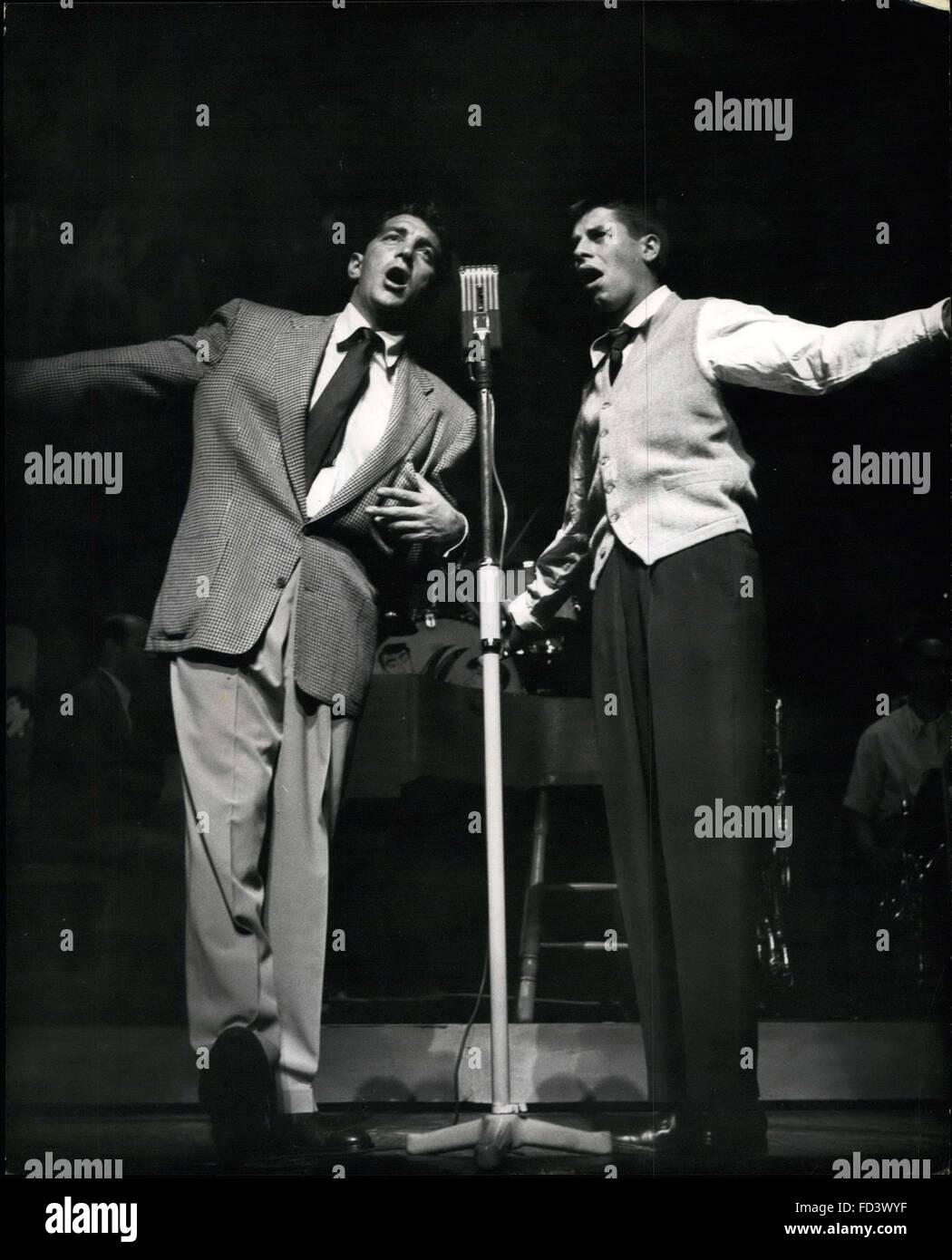 1947 - One of the few serious moments in the act when Dean Martin (left) and Jerry Lewis sing a tuneful duet. Martin and Jewis are howling success at Paladu. Putting on one of the noisiest and craziest turns the Palladium has ever seen, Dean Martin and Jerry Lewis acorad a tromendous success at the start of their two weeks appearance . Stars of eight Paramount films, Martin and Lewis are also incomparable theatre and night club entertainers, while their gramphone records also have an international following . Martin started his theatrical career as a dance band singer while Lewis started b Stock Photo