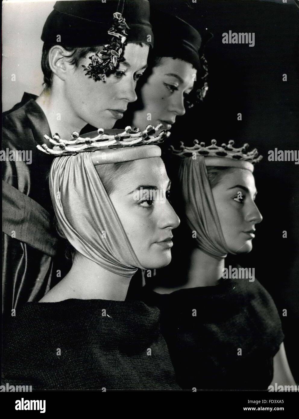 1956 - Models as seen in a mirror Line Vautrin, a Paris milliner, is now showing her latest collections whose unusual feature is the mirror trimming. OPS: Two of the models entitled Little Queen (foreground) a jersey hat with a crown made of little blue mirrors and PlateauÃ red velvet hat trimmed with a little mirrors. © Keystone Pictures USA/ZUMAPRESS.com/Alamy Live News Stock Photo