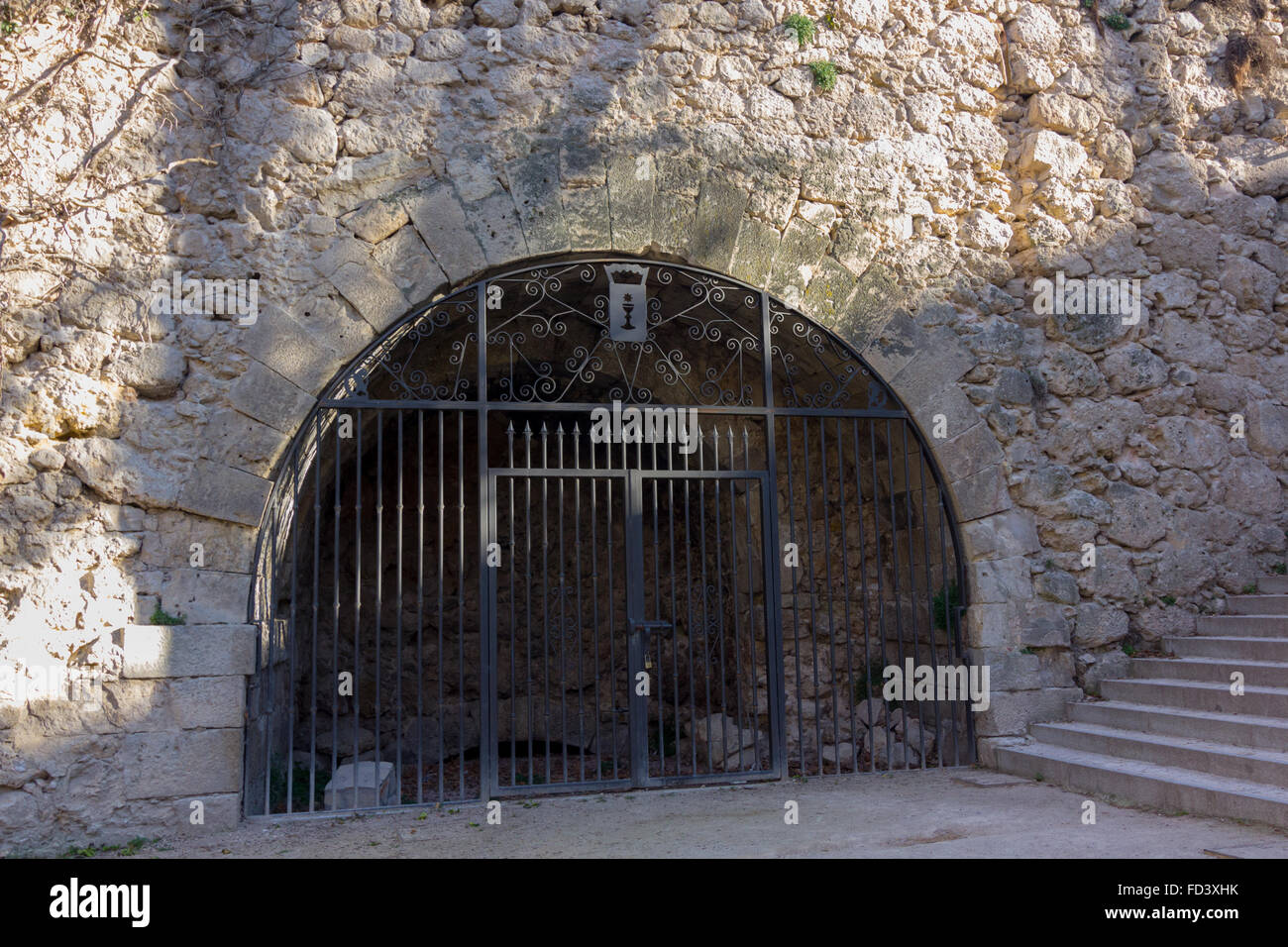 iron gate entrance to a cave Stock Photo Alamy