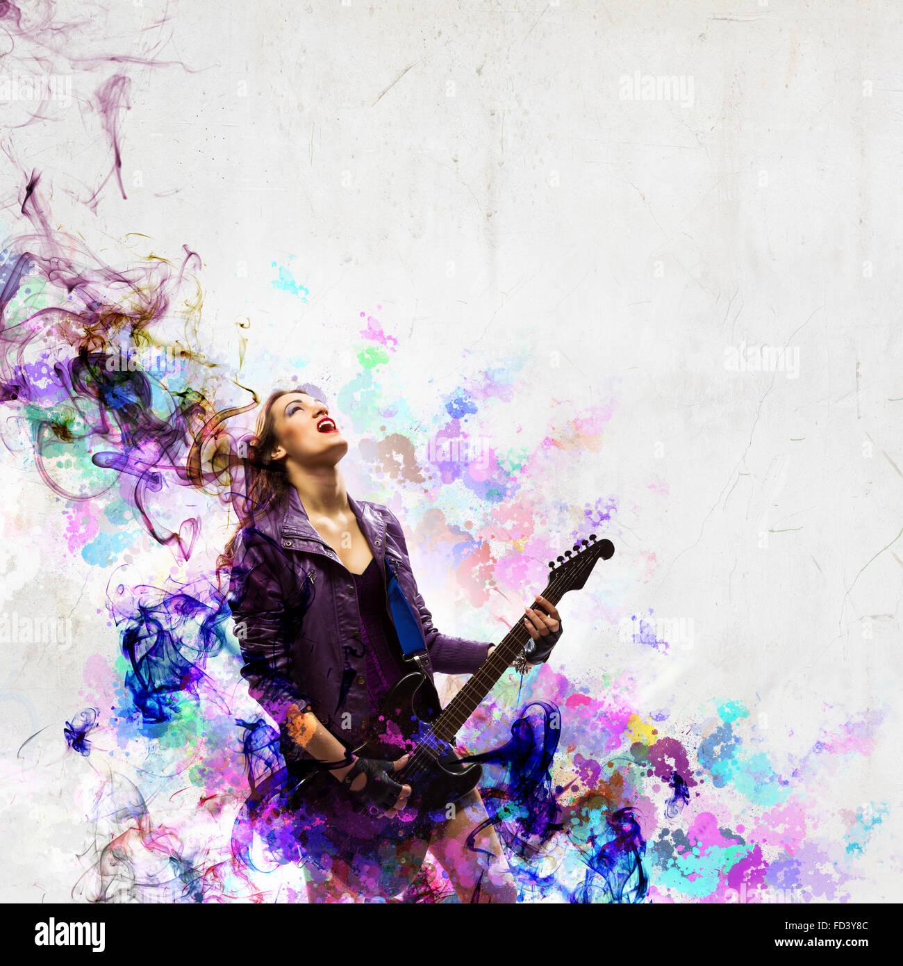 Young attractive rock girl playing the electric guitar Stock Photo - Alamy