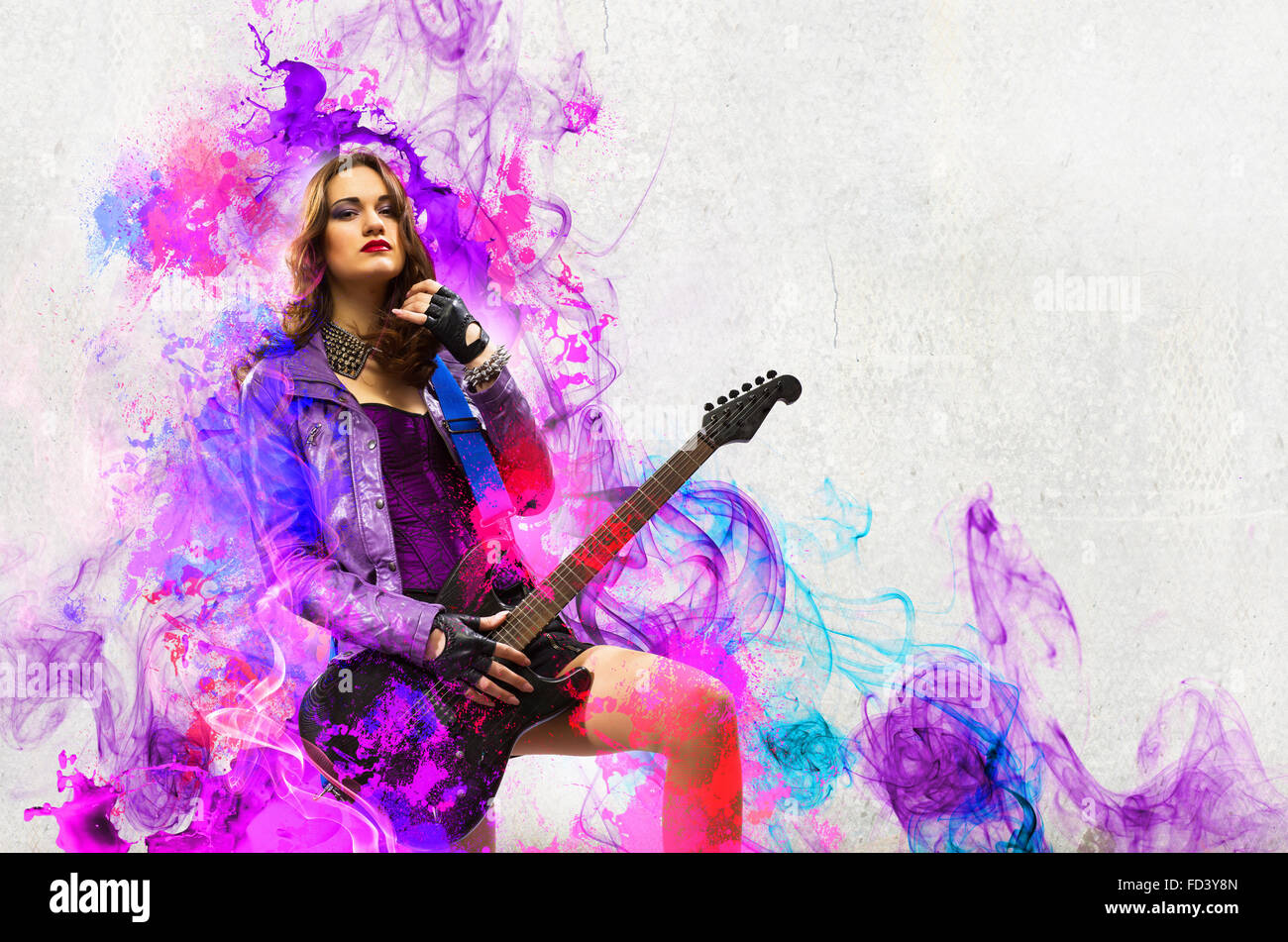 Young attractive rock girl playing the electric guitar Stock Photo - Alamy