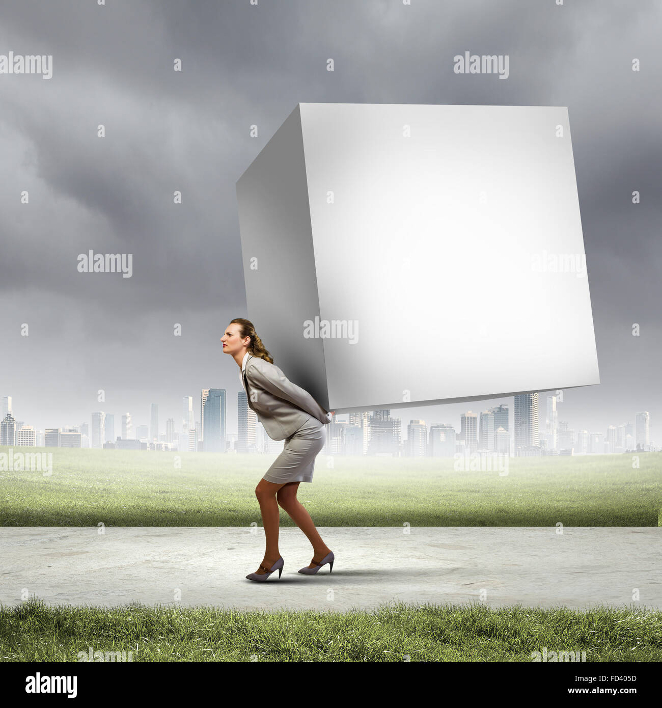 Image of businesswoman carrying big white cube on her back. Place for text Stock Photo