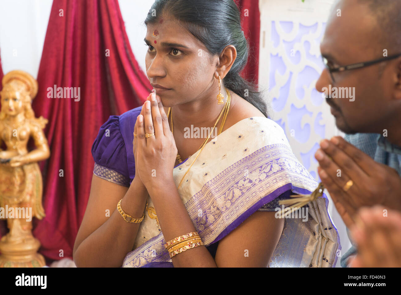 People pray during praying events. Traditional Indian Hindus ear ...