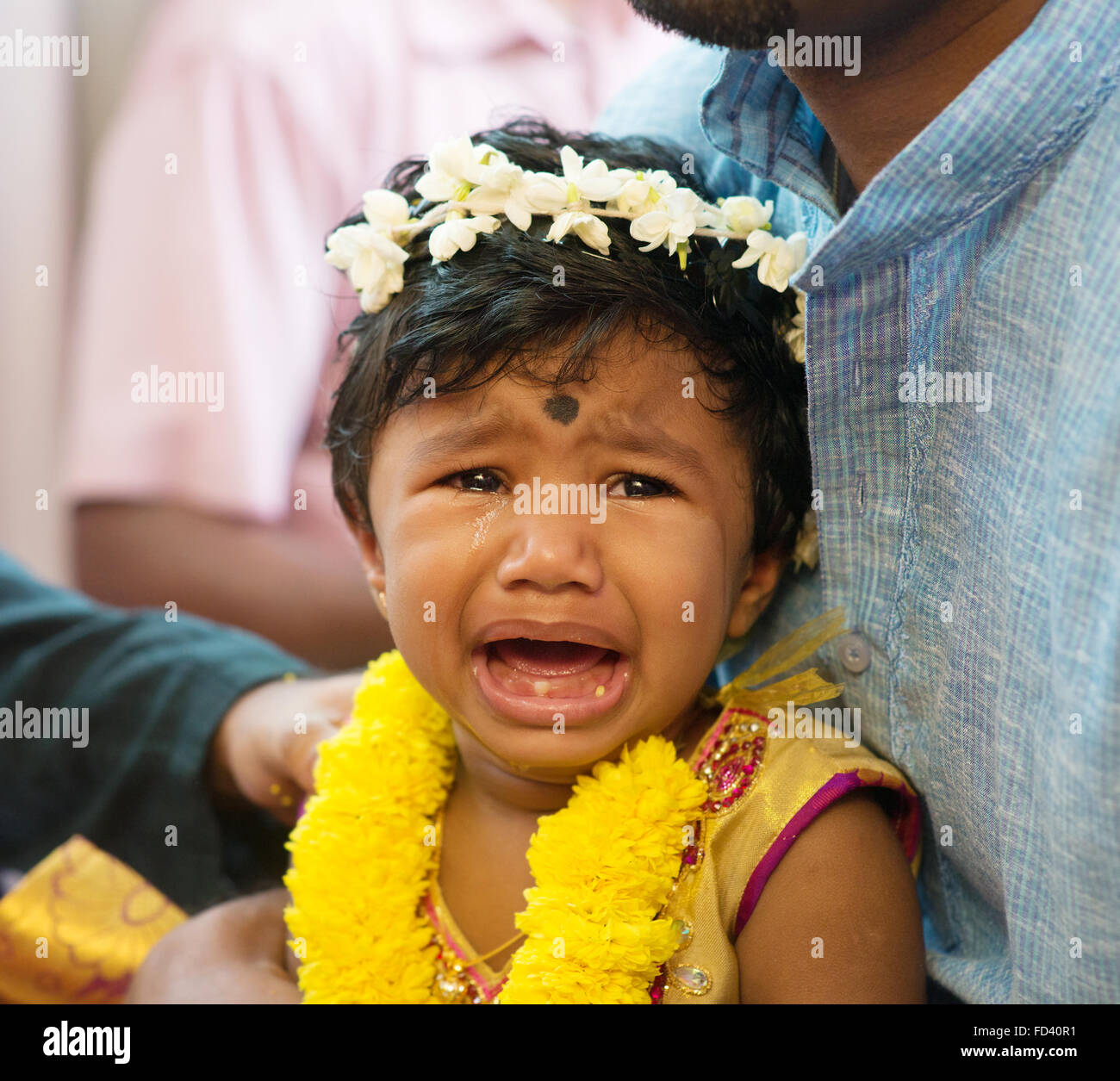 Baby girl crying after karna vedha events. Traditional Indian Hindus