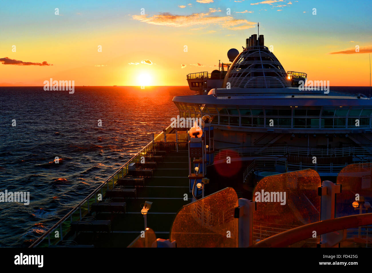P&O cruise ship Ventura sunset at sea blue red sky Stock Photo