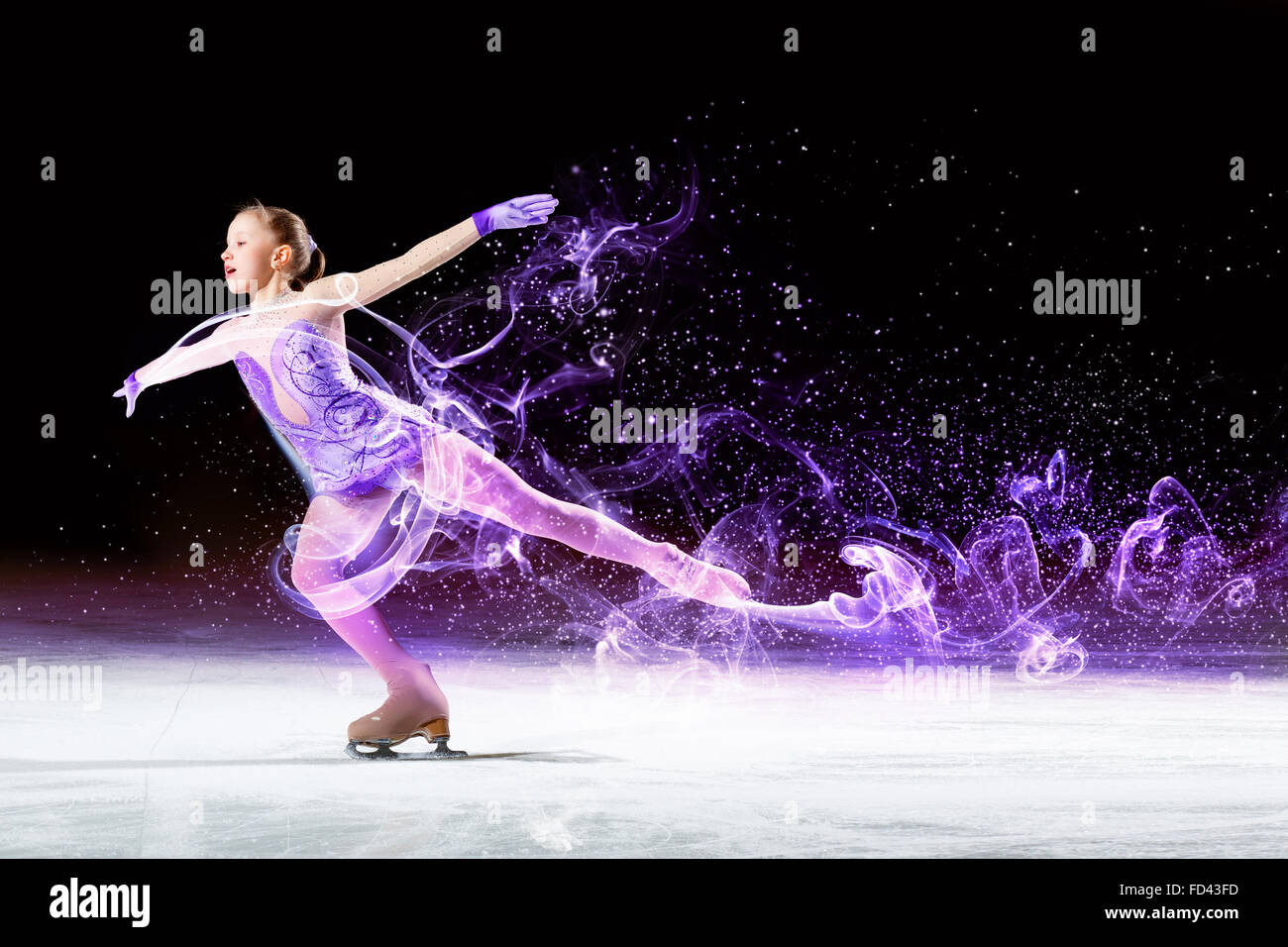 Little girl figure skating at sports arena Stock Photo Alamy