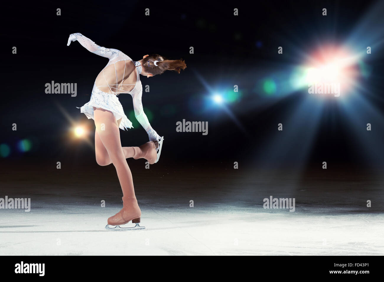Little girl figure skating at sports arena Stock Photo Alamy
