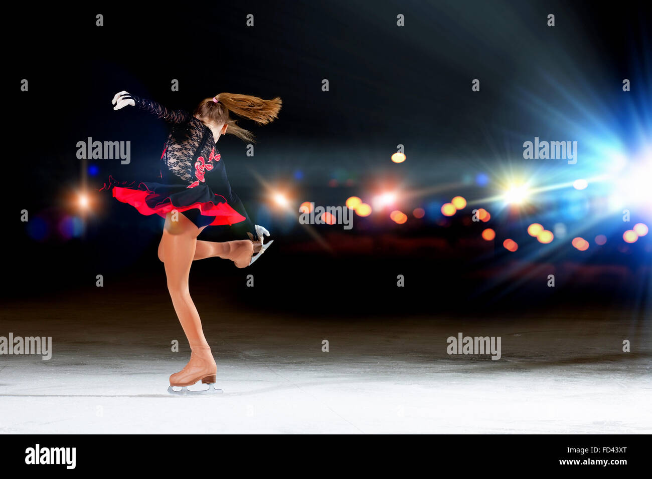 Little girl figure skating at sports arena Stock Photo Alamy