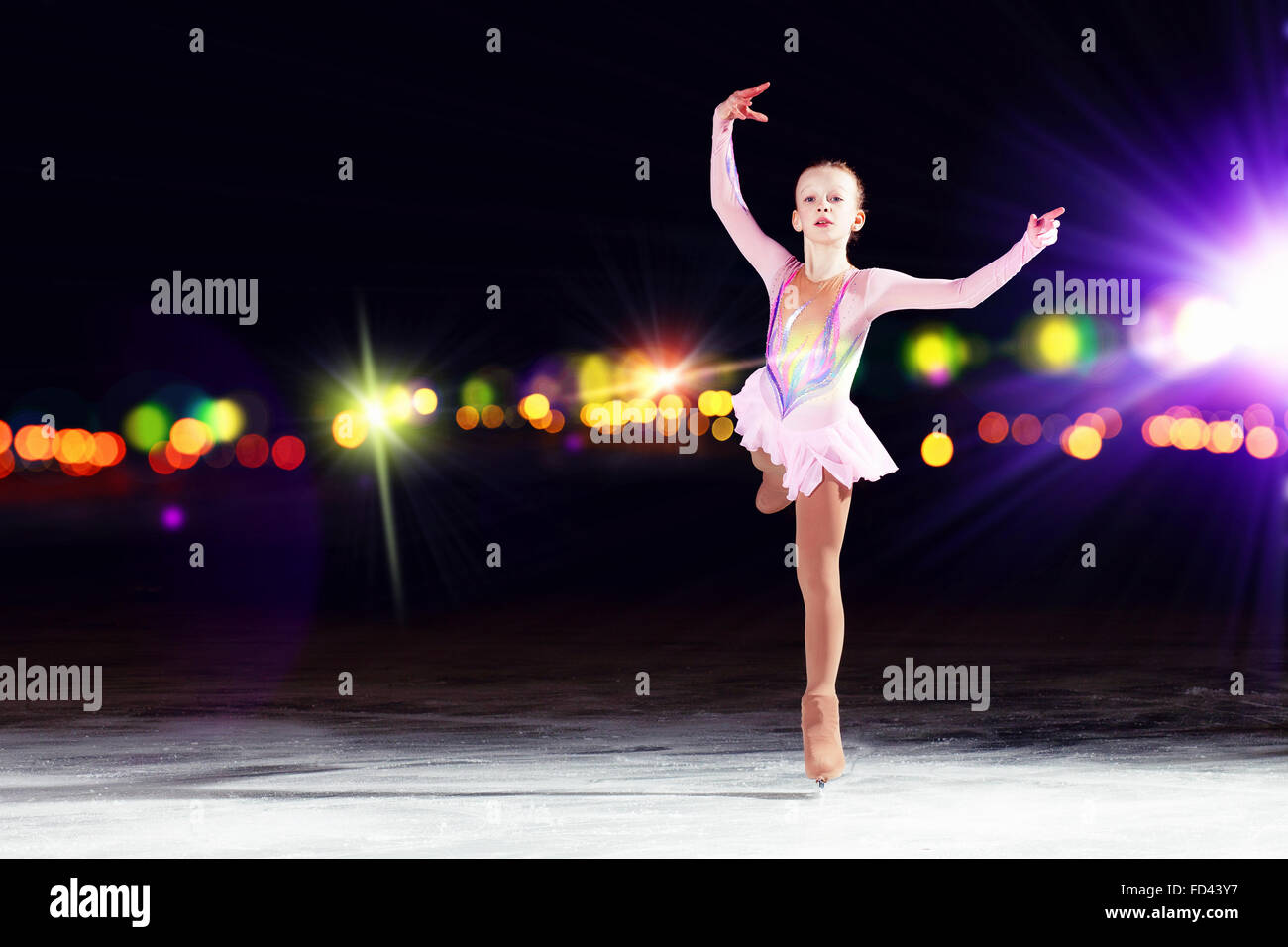 Little girl figure skating at sports arena Stock Photo Alamy